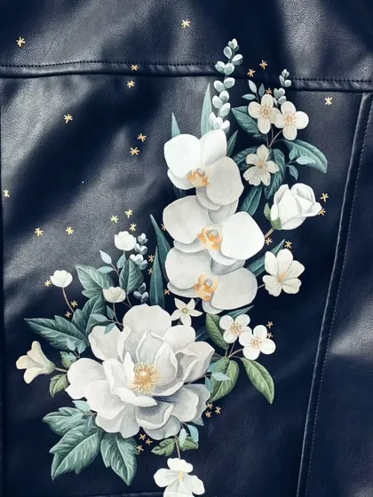 Transform an old leather jacket into a delicate floral masterpiece. We teach you the specific techniques needed for painting on different materials, ensuring your design is both beautiful and durable.