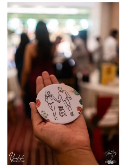 A personalized coaster featuring a custom illustration of the couple with their beloved pet pug. These small, thoughtful details make guests feel truly included in the couple's story.