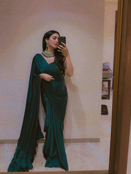 A selfie in a stunning emerald green satin saree. I love playing with different colors and fabrics.