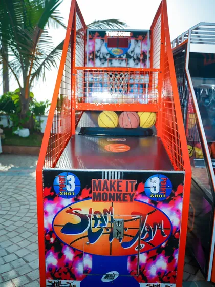 A close-up of the 'Slam Jam' arcade basketball game, a popular choice for sports-themed parties and events.