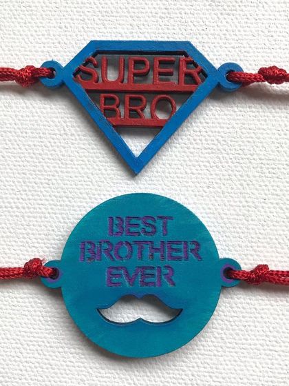 For the superhero in your life. This set includes 'Super Bro' and 'Best Brother Ever' rakhis, hand-painted in bold colours on MDF cutouts.