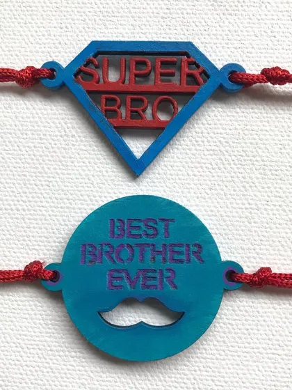For the superhero in your life. This set includes 'Super Bro' and 'Best Brother Ever' rakhis, hand-painted in bold colours on MDF cutouts.