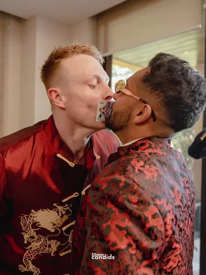 The groomsmen partake in a game, passing a card from mouth to mouth. These moments of glorious chaos and laughter are just as important as the solemn rituals.