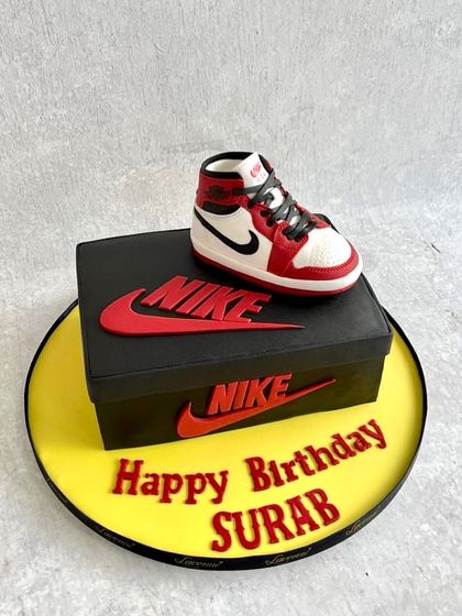 For the sneakerhead in your life. This cake is designed to look like a Nike shoebox, with a hyper-realistic, completely edible Air Jordan sneaker on top. Every detail, from the laces to the logo, is crafted from sugar.