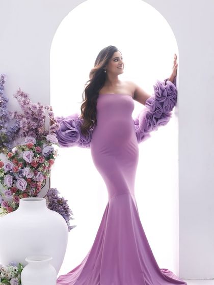 Looking towards the light and the future. This portrait captures a sense of hope and anticipation, with the purple gown adding a pop of regal color.