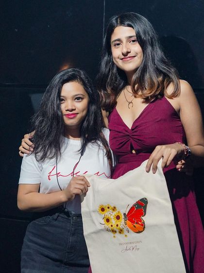 Meeting a fan and seeing her with my custom merch. The response has been overwhelming, and it feels amazing to see my art connect.