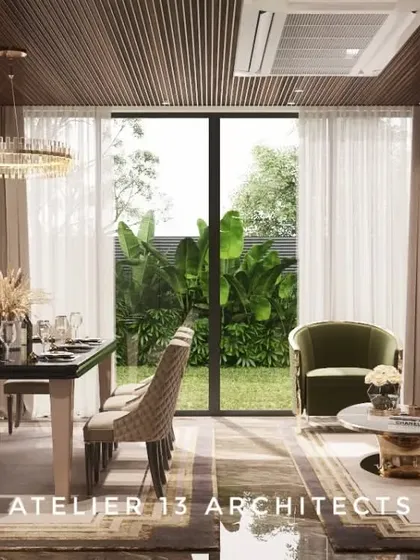 This open-plan living and dining area is designed for a modern lifestyle, with views of the garden. The dining set is positioned to feel connected to the lounge area, unified by a neutral palette and a shared wooden ceiling feature.