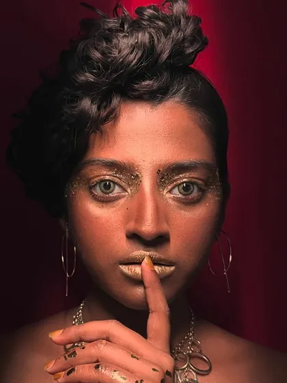 For this editorial shoot, I used gold foil and glossy textures to create a dramatic and artistic statement. This look is all about playing with light and texture, perfect for fashion stories that demand a unique and memorable visual.
