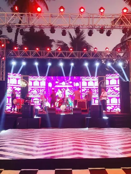 The stage is set for a live band performance at a Sangeet. I handle all the technical aspects, including the stage, sound, and lighting truss, to ensure top-notch entertainment for your event.