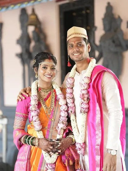 A beautiful couple portrait outside a temple. The bride's makeup is fresh and natural, perfect for a daytime wedding.