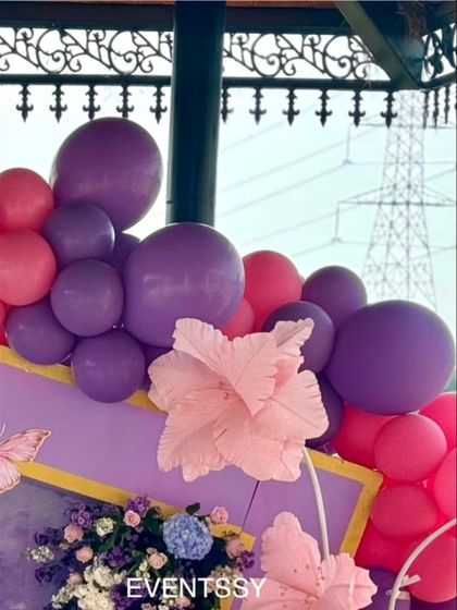 Another close-up of the pink and purple balloon garland, showing how different sized balloons are used to create a dynamic and organic shape.