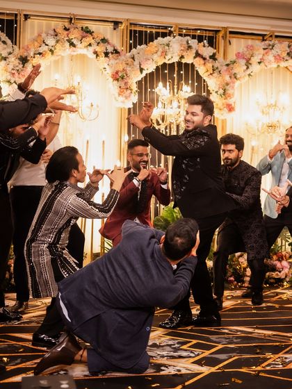 The groom's squad hyping him up on the dance floor. It's all about that brotherhood and energy.