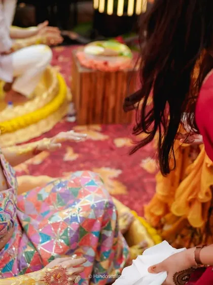 The aftermath of a fun-filled Haldi, with the bride laughing amidst a sea of yellow. These are the moments of pure joy that I love to help create.