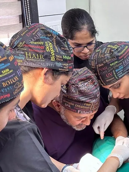A team of dermatologists observing a complex procedure. Collaborative learning and mentorship are key pillars of medical excellence and patient safety.