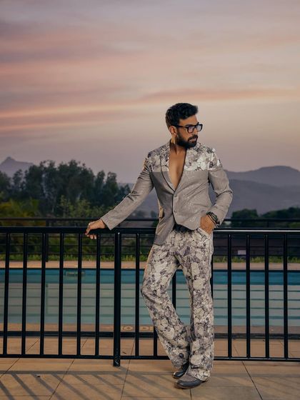 Made to stand out, never meant to blend in. This grey floral suit from the Sukoon collection is for the man who owns the room without saying a word, pictured here against a stunning sunset.