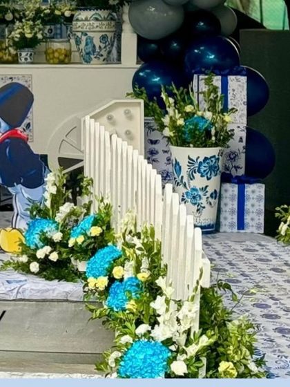 A close-up of the walkway, showing the beautiful floral arrangements in themed vases.