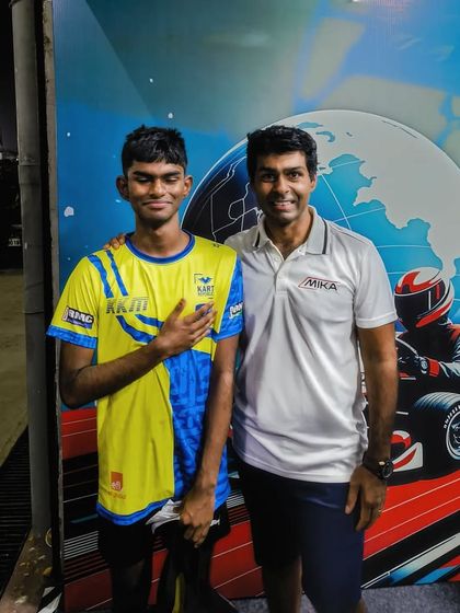 A driver with a team member, showing the strong bond within the krew.