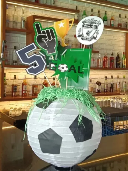 This duplicate image of the sports centerpiece shows how small details can enhance the overall party theme.