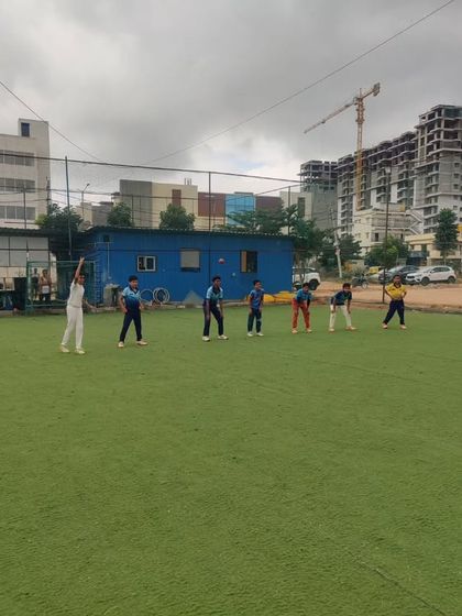 A coach hitting catches to the U-10 group. We use a variety of drills to keep the sessions interesting and effective.