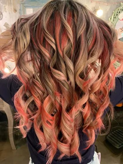 A close-up of the 'Peach Fuzz' curls. The color is multi-dimensional and full of life.