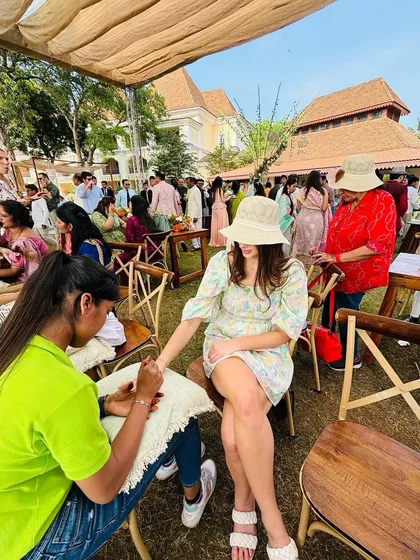 Bringing the joy of mehndi to your guests is one of my favorite things to do. Here, my team is seen at a beautiful outdoor wedding event, ensuring every guest gets a touch of henna art to join in the celebration.