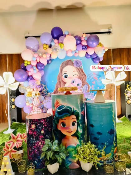 A close-up of the mermaid-themed cake stands, featuring characters from The Little Mermaid and underwater scenery.