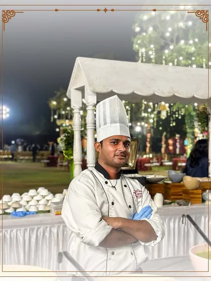 A portrait of one of our talented chefs at an outdoor event. Behind every iconic dish is a culinary expert dedicated to crafting an unforgettable experience.