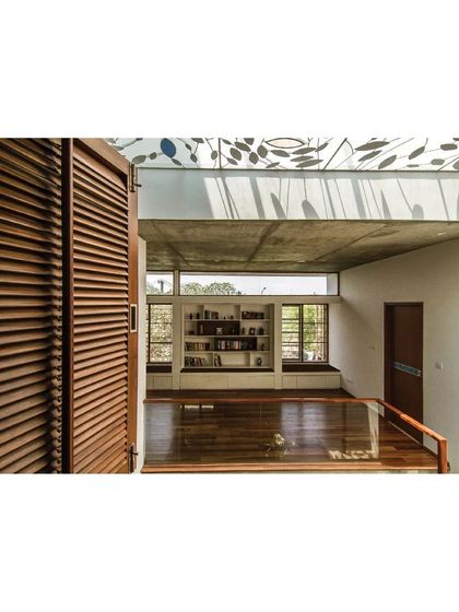 A reading nook in the Cube Square house, situated on the upper-level bridge, benefits from the light filtering through the custom-designed skylight.