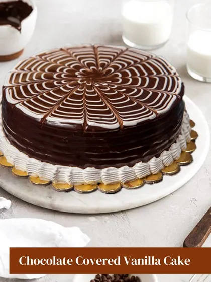 A classic combination of flavors, this Chocolate Covered Vanilla Cake features a delicate vanilla sponge covered in a rich, glossy chocolate ganache. The spiderweb design on top adds a touch of elegance.