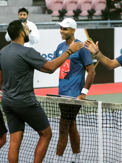 Sportsmanship and respect are core values we uphold. Shaking hands after a hard-fought match in the Pro Tennis League.
