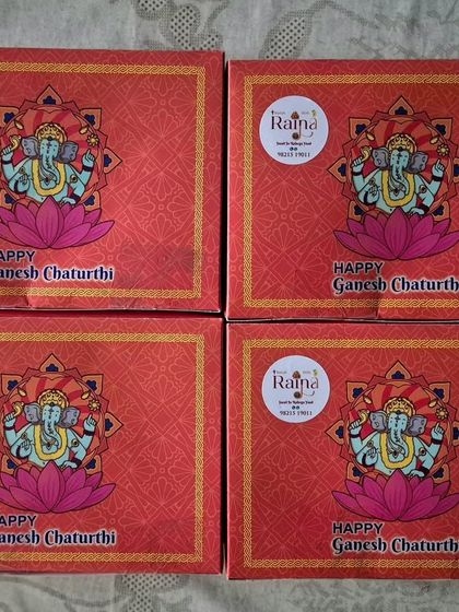 Four of my festive Ganpati boxes, each with my personal brand sticker. It's a pleasure to be a part of my clients' celebrations.