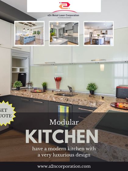 This two-tone modular kitchen combines dark grey base cabinets with frosted glass upper cabinets. The design includes a built-in microwave and oven, showcasing our ability to create luxurious and highly functional kitchen spaces.