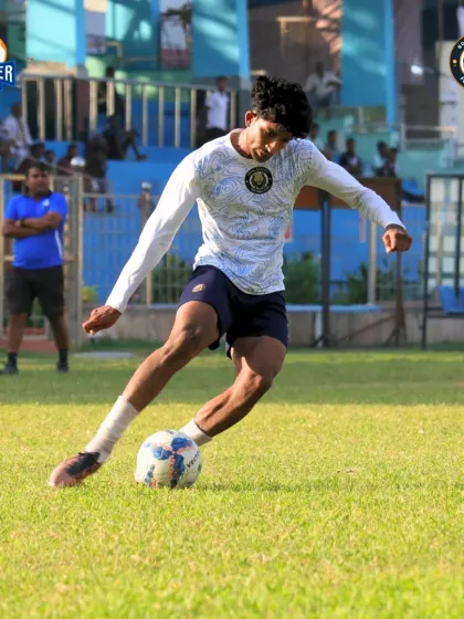 Focused and on the ball, our player looks to make a play in the attacking half.