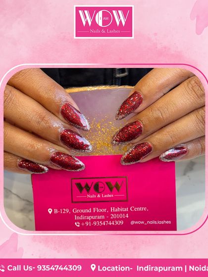 Feel the party with these long, almond-shaped extensions in a vibrant, sparkling red glitter. This look is all about glamour and is guaranteed to make your hands the center of attention.