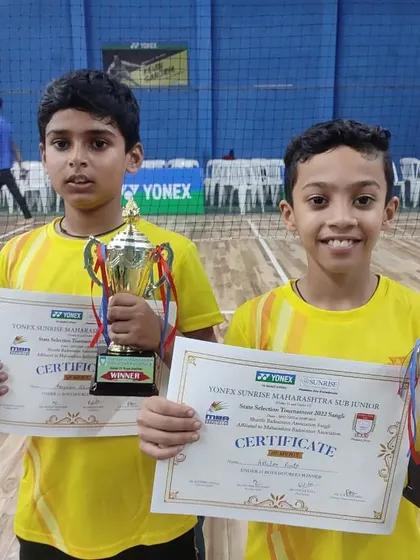 The official certificates and trophies from the Yonex Sunrise Maharashtra state level tournament. This win is a huge accomplishment for our young U-11 doubles champions.