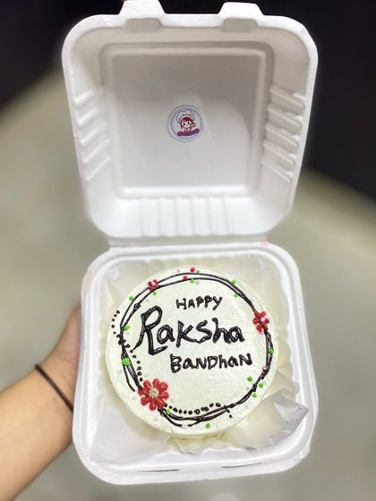 Our simple and sweet "Happy Raksha Bandhan" bento cake, a key part of our popular Rakhi hampers.