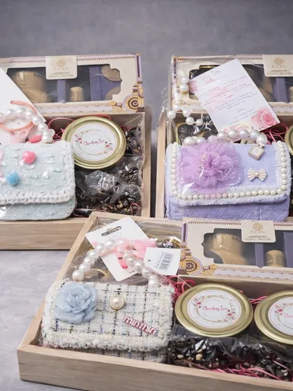 Finding the perfect gift for a baby girl's birthday can be tough. I designed these elegant wooden tray hampers to be both beautiful and practical, including handmade chocolates, snacks, and cute accessories like a mini handbag and hair ties.