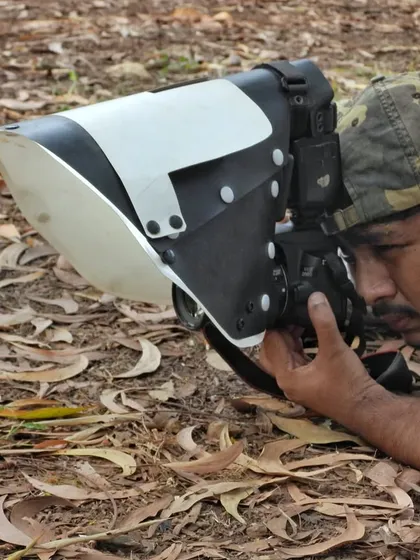 Getting the perfect shot often means getting low and close, always with respect for the animal. Here I am photographing an Indian Spectacled Cobra, using a diffuser to capture its intricate details. This is the dedication that goes into every frame.