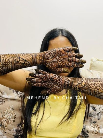 Another view of the beautiful engagement mehendi, showing the intricate patterns on the back of the hands and arms.