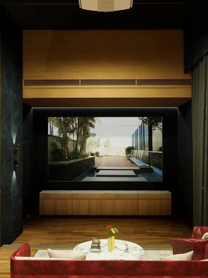 The view towards the screen, showing the integrated cabinetry and the sound-absorbent curtains that ensure an immersive experience.