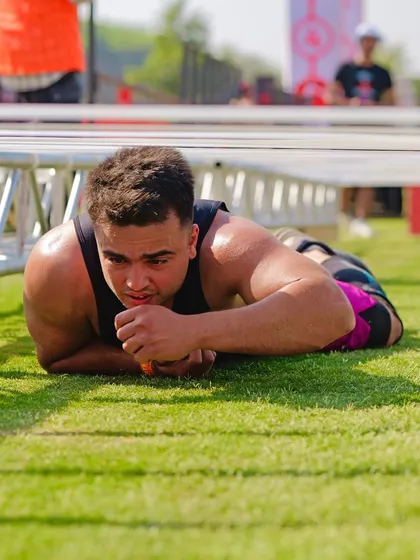Crawling under an obstacle at The Yoddha Race. It's not just about strength; it's about agility and being able to move your body in different ways, even when you're exhausted.