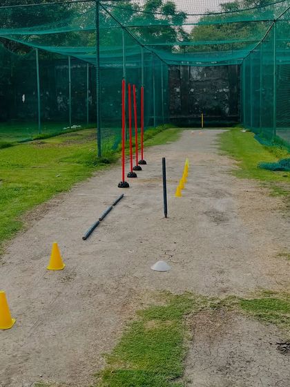 The practice pitch is set. Using cones and poles helps a bowler visualize their line and length, and forces them to maintain discipline in their action.