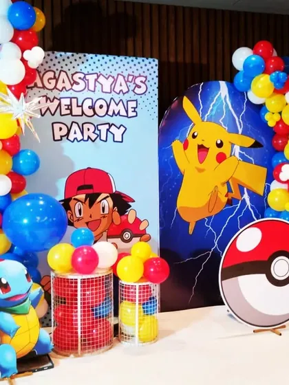 Gotta catch 'em all! A fun Pokémon-themed welcome party for Agastya, featuring Pikachu, Ash, Squirtle, and a giant Poké Ball, all brought to life with colorful balloons and cutouts.