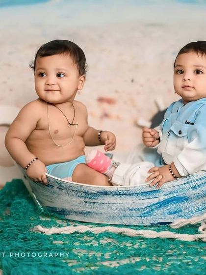 This sailor-themed shoot for two siblings is incredibly creative. Posed in a miniature boat prop, they look like they are ready to set sail on an adventure together.