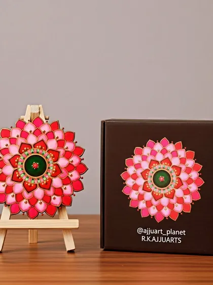 A beautiful mandala in shades of red and pink, symbolizing love and passion. Like many of my smaller pieces, it is presented on an easel and comes packaged in a custom box.