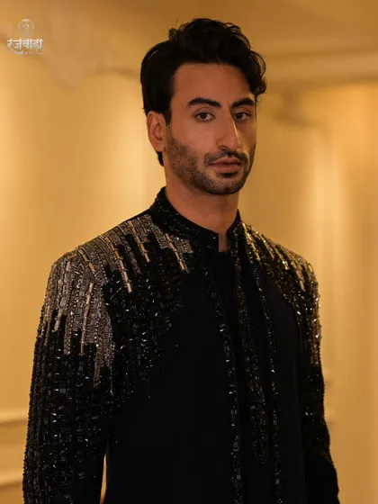 Make a powerful statement at your next evening event. This close-up highlights the cascading sequin and beadwork on one of my signature cocktail jackets, designed for maximum impact.