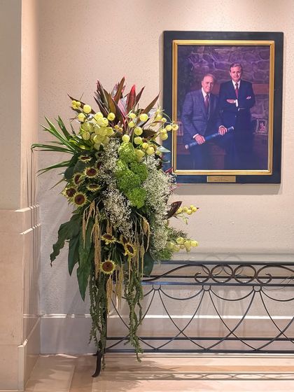 A smaller, elegant foliage arrangement designed for a console table, proving that even compact spaces can be transformed with a touch of nature's artistry.