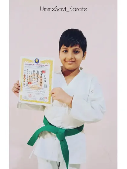 Proudly showing off his new green belt. This young karateka has been working hard on his techniques and it shows. 💚