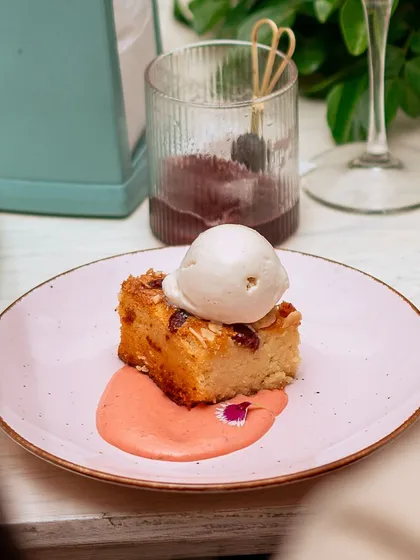 A beautiful slice of bread pudding topped with a scoop of vanilla ice cream, served during our Amalfi Sunday Brunch.