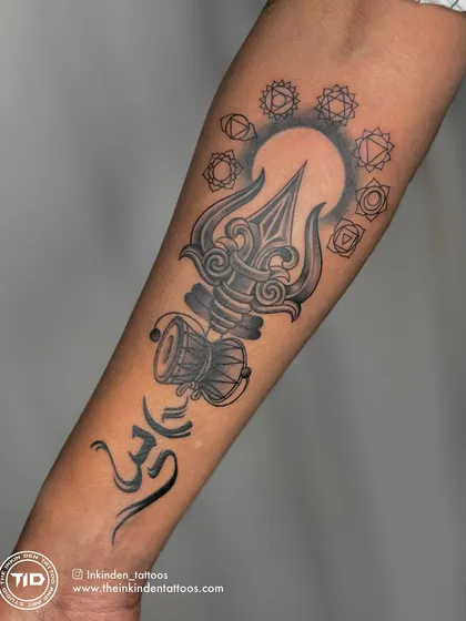 This forearm piece is a fusion of powerful spiritual symbols: the Trishul, Om, Damru, and the seven Chakras. Executed in black and grey, it highlights my ability to create spiritual art with a focus on realistic shading and depth.